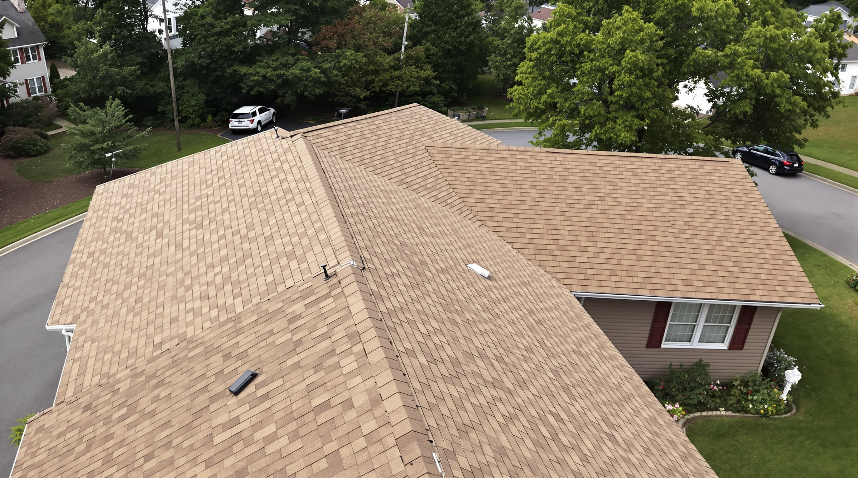 Roofing services with workers installing new roof tiles